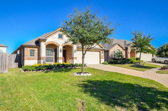 view of front of house with a garage and a front lawn