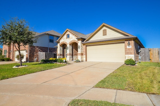 view of front of property featuring a garage and a front lawn