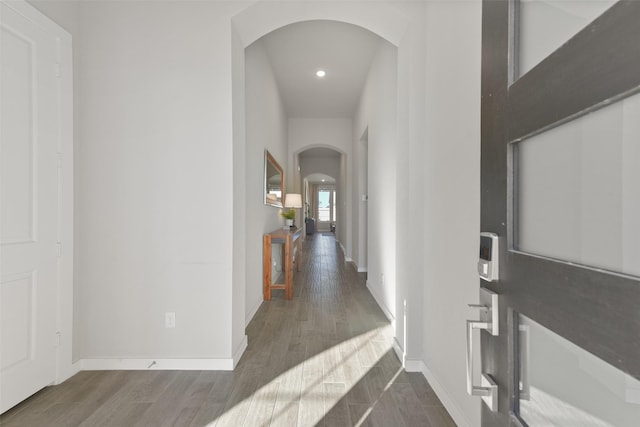 hall with dark hardwood / wood-style flooring