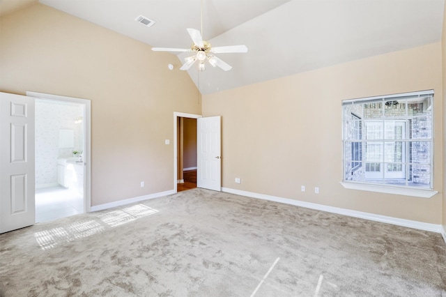 empty room with light carpet, ceiling fan, and high vaulted ceiling