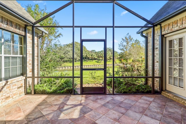 unfurnished sunroom featuring a wealth of natural light