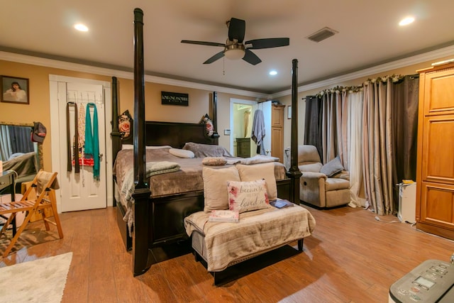 bedroom with ceiling fan, light hardwood / wood-style floors, and ornamental molding