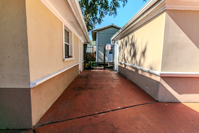 view of side of property with a patio