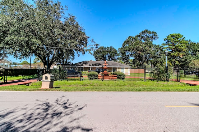 surrounding community featuring a lawn