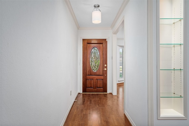 doorway featuring dark hardwood / wood-style floors and crown molding