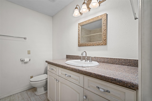 bathroom with tile patterned floors, toilet, and vanity