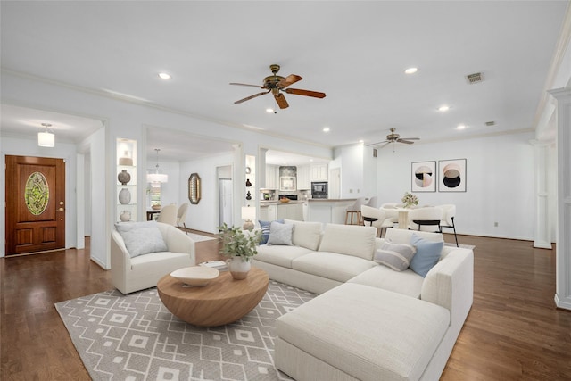 living room with ceiling fan, crown molding, and hardwood / wood-style flooring