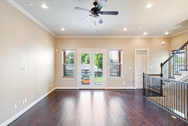 spare room with ceiling fan, dark hardwood / wood-style flooring, crown molding, and french doors