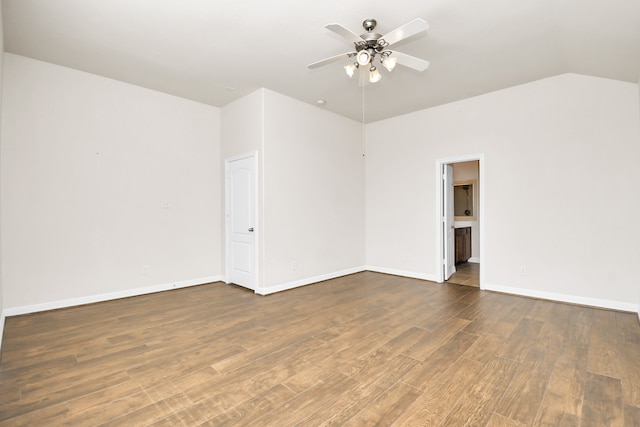 unfurnished room featuring lofted ceiling, ceiling fan, and dark hardwood / wood-style floors