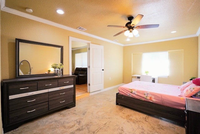 bedroom featuring ceiling fan, a textured ceiling, and ornamental molding