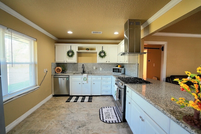 kitchen featuring island exhaust hood, stainless steel appliances, white cabinetry, and sink