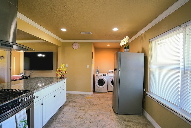 kitchen with stone counters, washer and dryer, range hood, appliances with stainless steel finishes, and white cabinetry