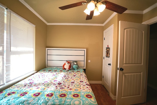 bedroom with ceiling fan, crown molding, and dark wood-type flooring