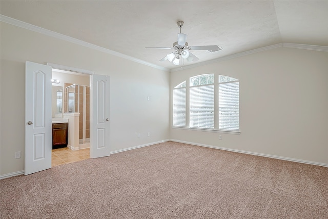 unfurnished room with ceiling fan, ornamental molding, light carpet, and vaulted ceiling