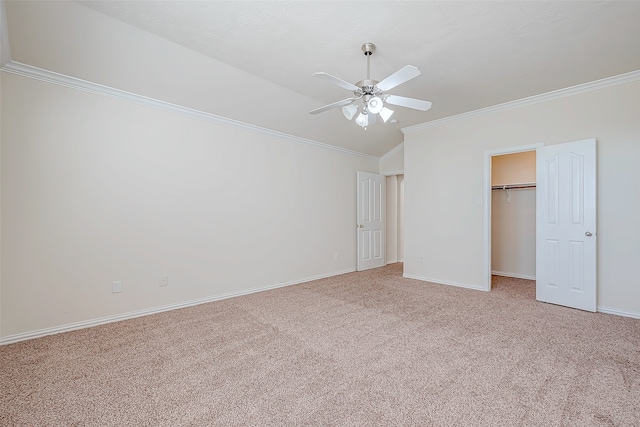 unfurnished bedroom featuring carpet flooring, ceiling fan, ornamental molding, and a closet