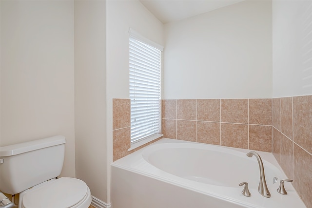 bathroom with a bathing tub and toilet