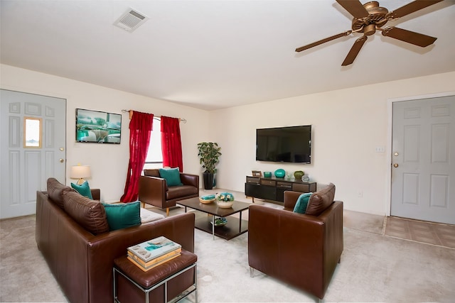 living room featuring ceiling fan and light colored carpet