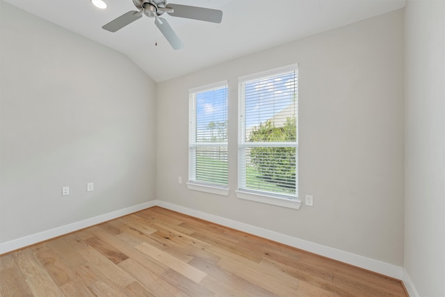 empty room with light hardwood / wood-style flooring, ceiling fan, and lofted ceiling