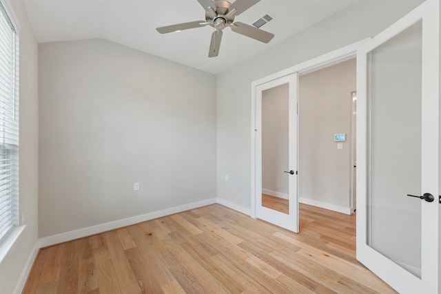 unfurnished bedroom with light wood-type flooring, multiple windows, and ceiling fan