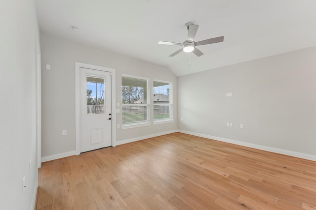 spare room featuring ceiling fan, light hardwood / wood-style flooring, and vaulted ceiling