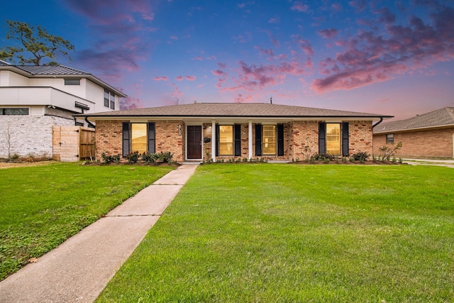 view of front of property with a yard