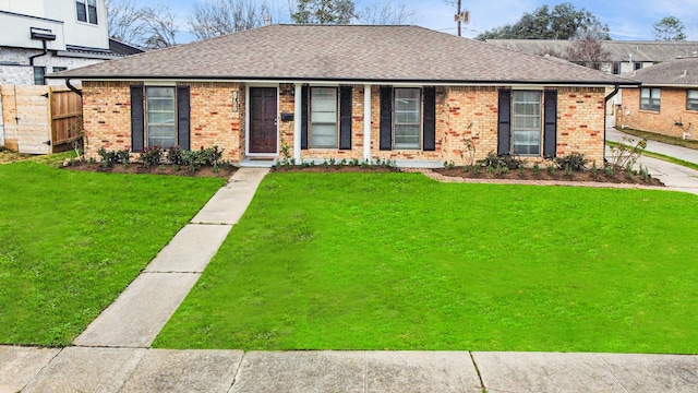 single story home with a front yard