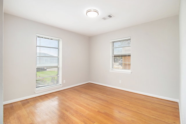 unfurnished room featuring light hardwood / wood-style floors