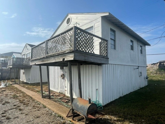 view of home's exterior featuring a wooden deck