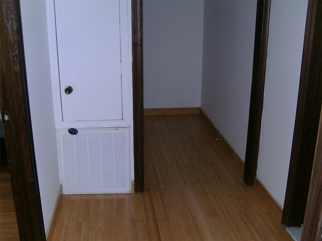 hallway with light wood-type flooring