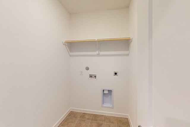 laundry room featuring washer hookup, electric dryer hookup, and light tile patterned floors