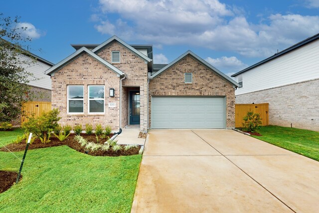 craftsman inspired home featuring a front yard and a garage