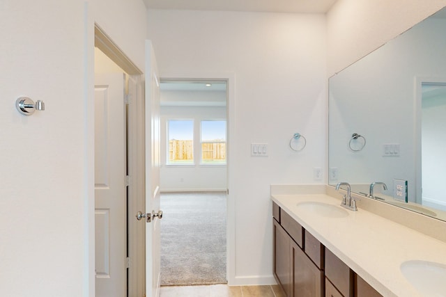 bathroom featuring tile patterned flooring and vanity