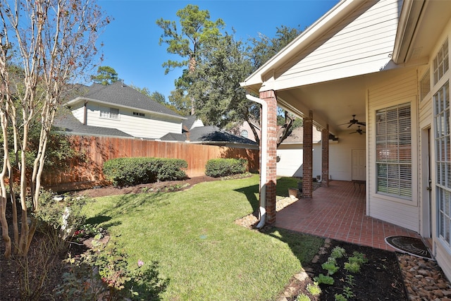 view of yard featuring a patio and ceiling fan