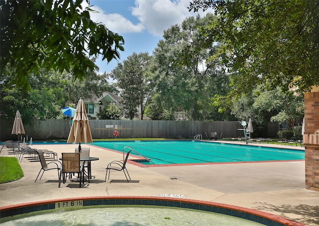 view of swimming pool with a patio