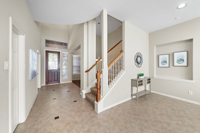 entryway featuring light tile patterned floors