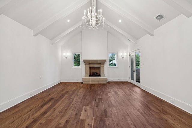 unfurnished living room featuring hardwood / wood-style floors, beam ceiling, and high vaulted ceiling