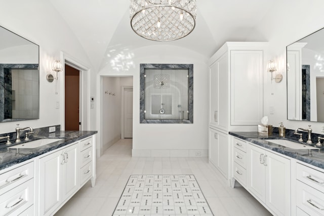 bathroom with vanity and vaulted ceiling