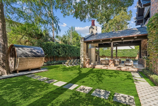 view of yard featuring an outdoor living space, a gazebo, a storage shed, and a patio