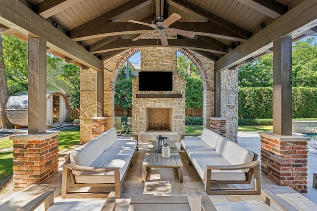 view of patio with a gazebo, an outdoor living space with a fireplace, and ceiling fan