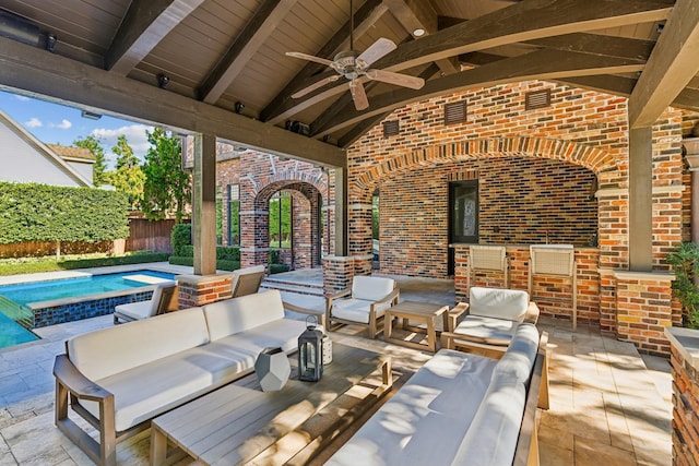 view of patio / terrace featuring an outdoor living space, a pool, and ceiling fan