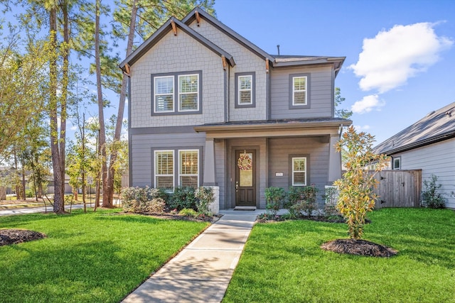 craftsman-style home featuring a front lawn