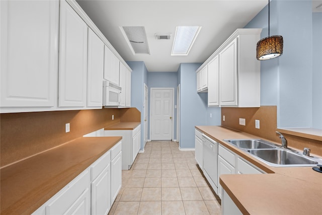 kitchen with pendant lighting, white cabinetry, white appliances, and sink