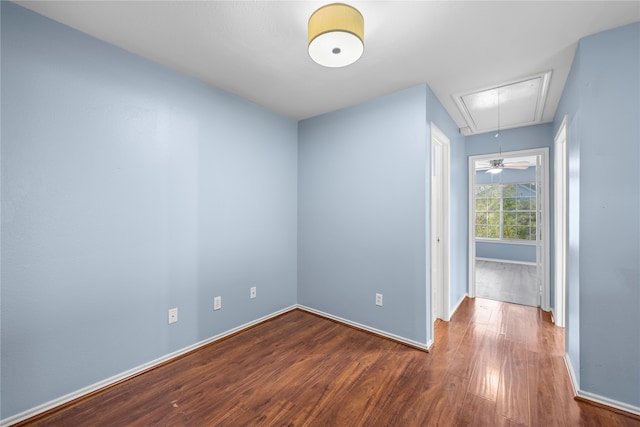 spare room with hardwood / wood-style flooring