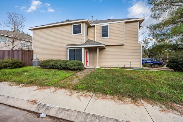 front of property featuring a front lawn and central AC unit