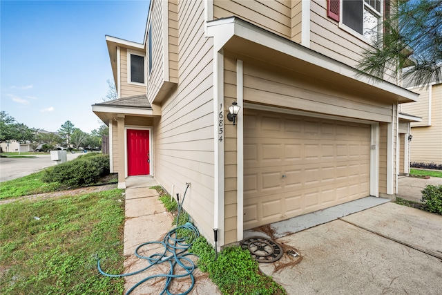 doorway to property featuring a garage