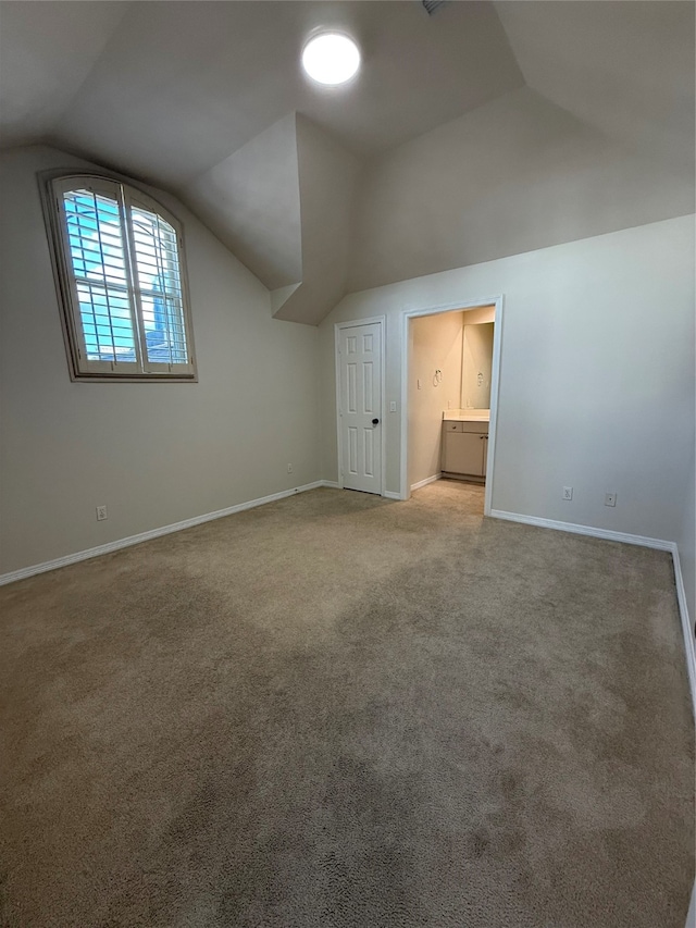 bonus room with carpet flooring and lofted ceiling