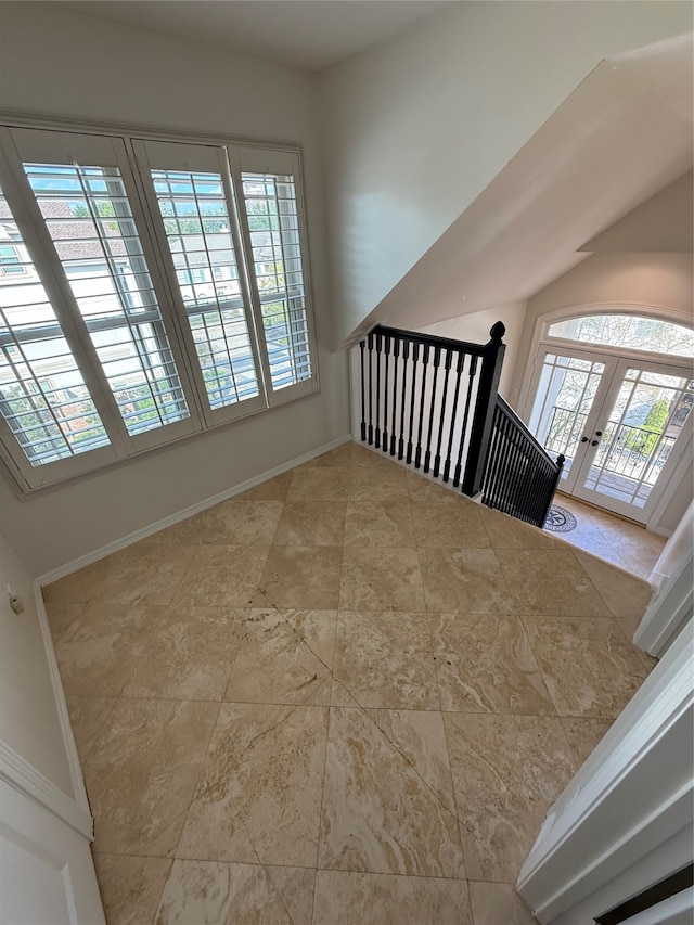 stairs with french doors