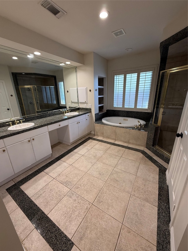 bathroom featuring tile patterned flooring, vanity, and independent shower and bath