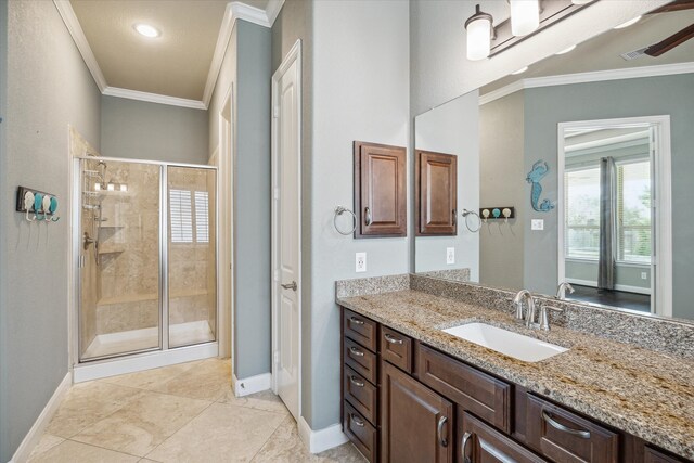 bathroom with crown molding, tile patterned flooring, vanity, and an enclosed shower