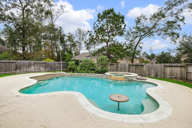 view of swimming pool featuring an in ground hot tub